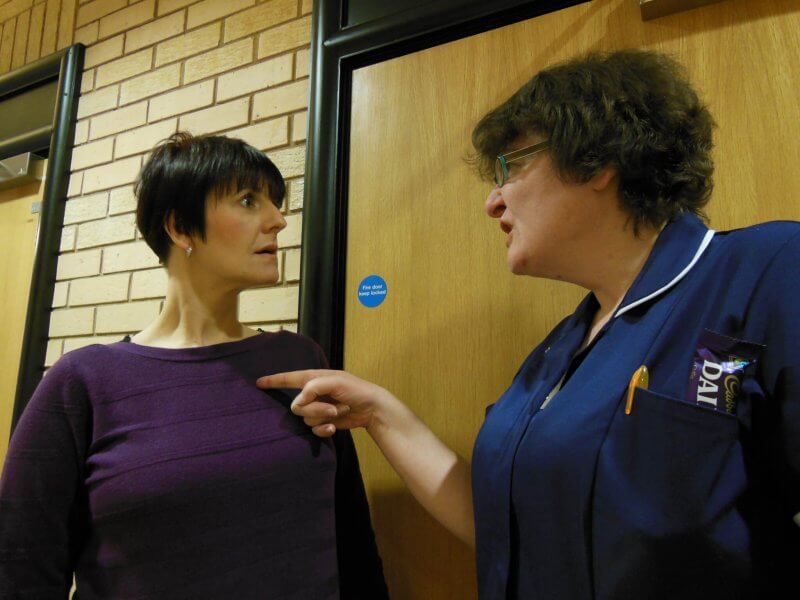 Image showing a nurse manager bullying a member of staff
